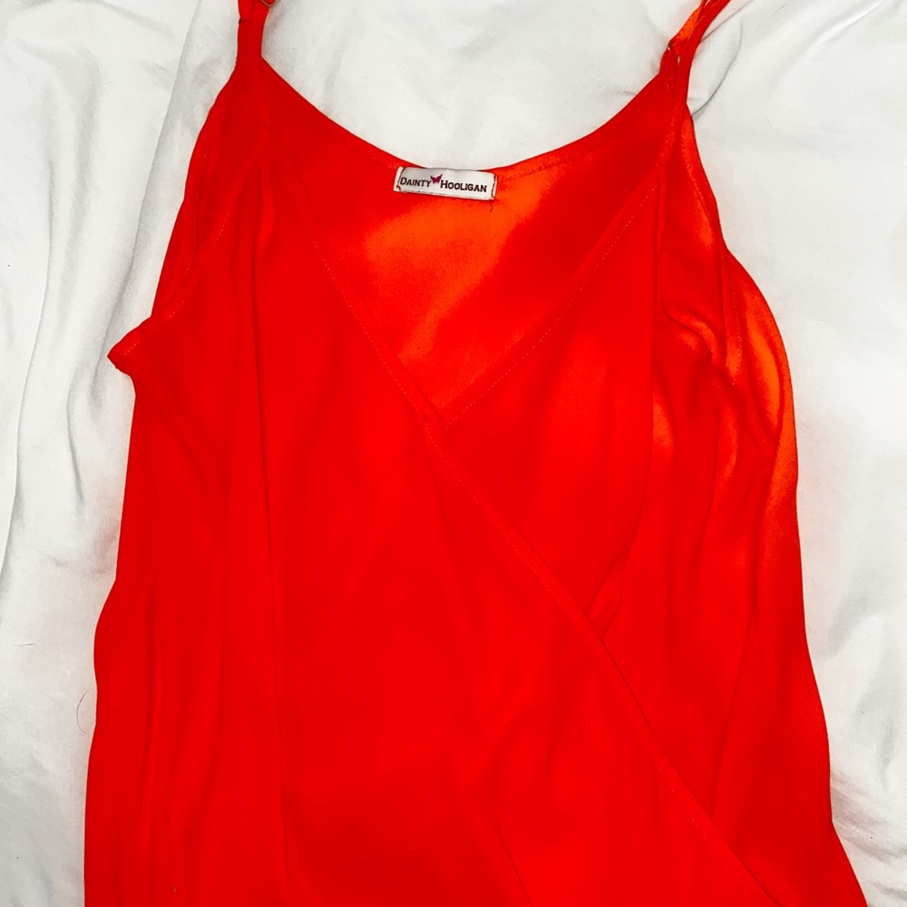 Fluorescent Orange. Adjustable straps.